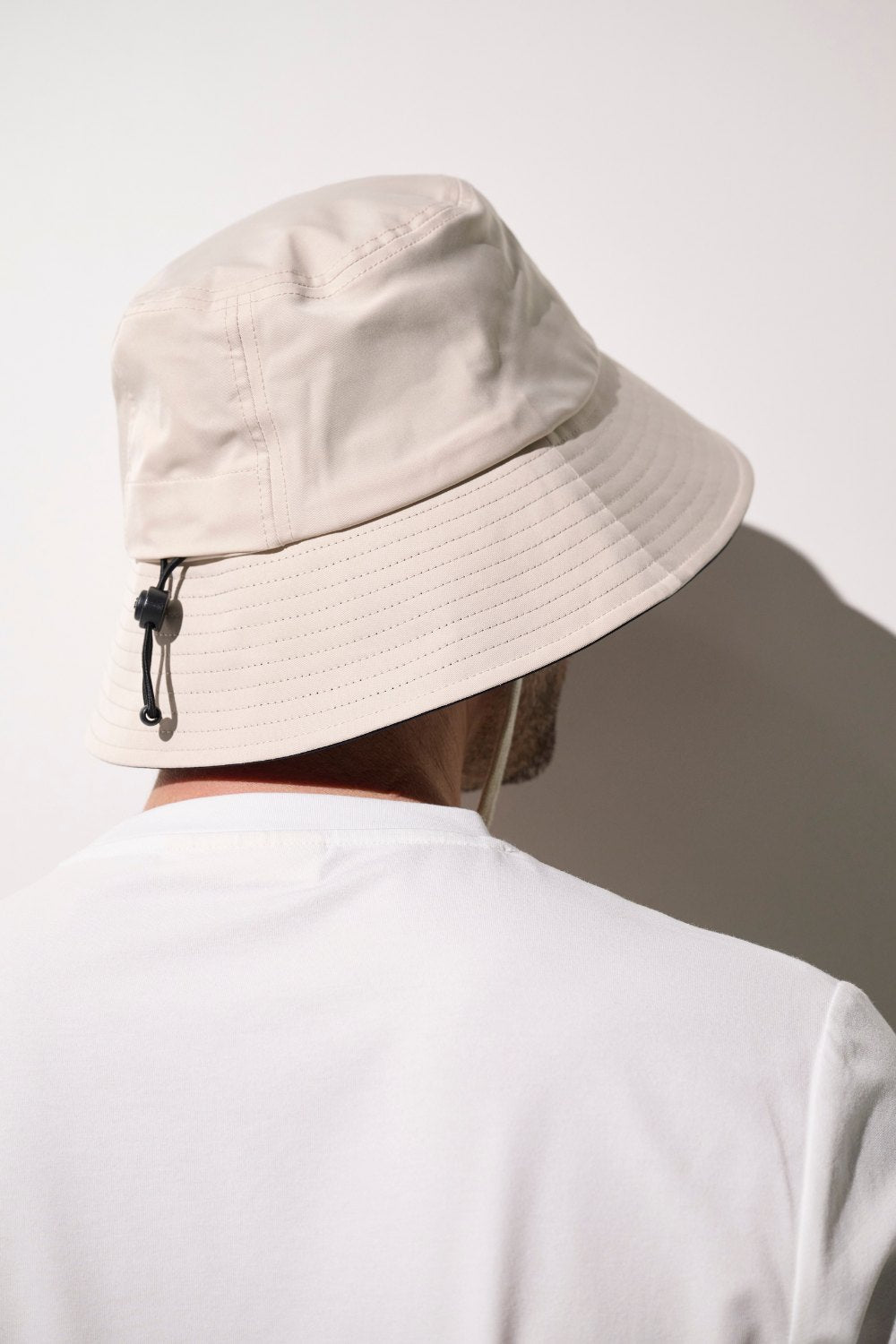 Bob anti-UV - Faro beige pour homme, léger et pliable, offrant une protection solaire efficace.
