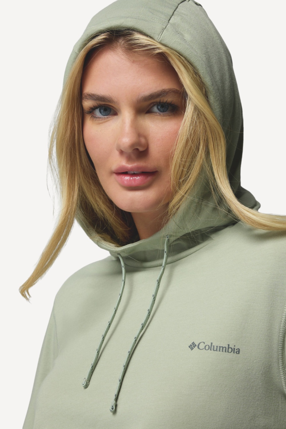 Sweat-shirt anti-UV vert clair pour femme de Columbia, protection UPF 50+ et capuche ajustable.