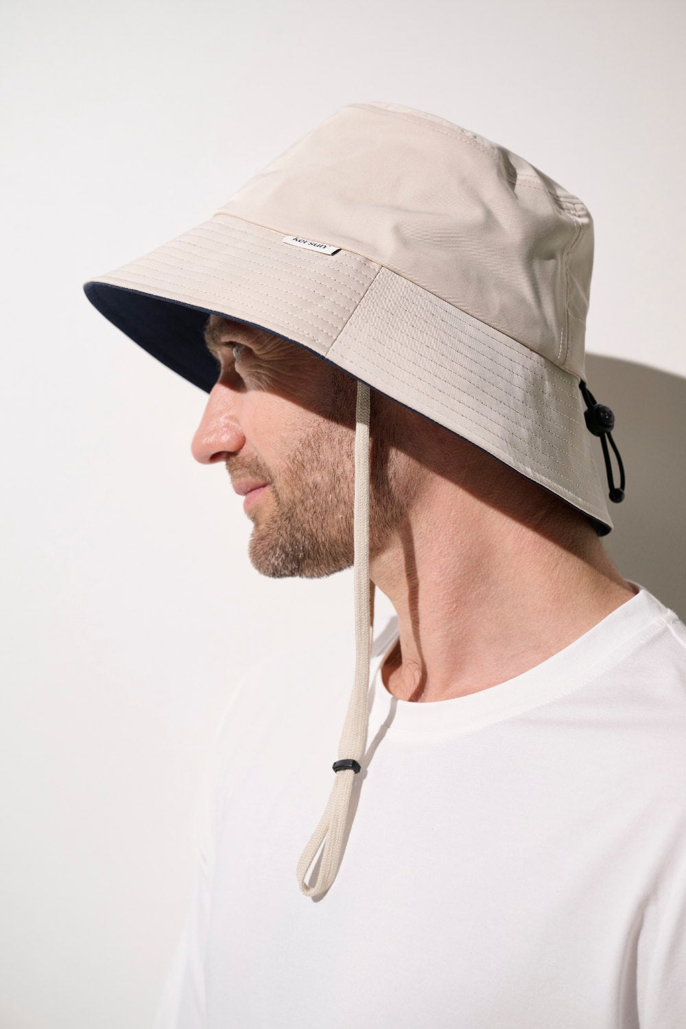 Bob anti-UV - Faro beige pour homme, léger et pratique, offrant une protection solaire UPF 50+.
