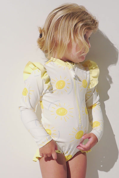 Maillot de bain anti-UV manches longues - Flores pour fille, léger, UPF 50+, avec motifs ensoleillés.