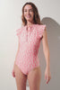 Maillot de bain anti-UV manches courtes - Pacific, rose à motifs, élégant et léger pour une protection solaire optimale.