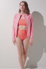 Veste de bain anti-UV - Moorea pour femme, rose à motifs, manches longues, UPF 50+ pour baignade et confort.